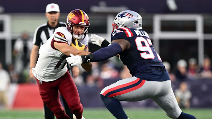 Aug 8, 2025; Foxborough, Massachusetts, USA; New England Patriots defensive end Milton Williams (97) tackles Washington Commanders wide receiver Luke McCaffrey (11) during the first half at Gillette Stadium. Mandatory Credit: Brian Fluharty-Imagn Images