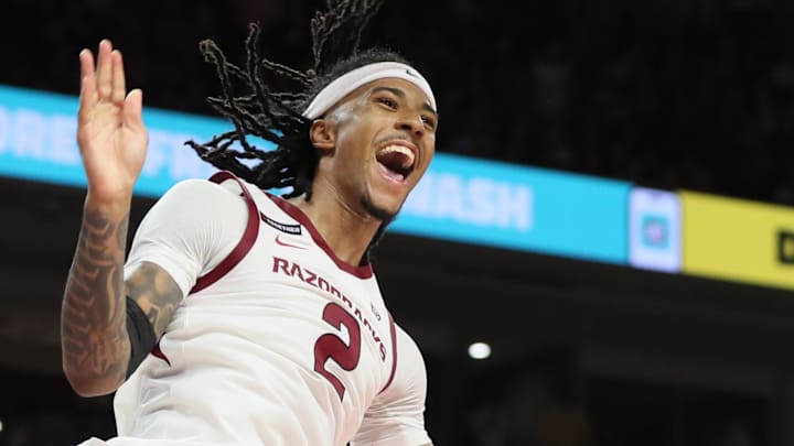 Arkansas Razorbacks guard Boogie Fland (2) dunks the ball in the second half against the Kansas Jayhawks at Bud Walton Arena. Arkansas Razorbacks guard Boogie Fland (2) dunks the ball in the second half against the Kansas Jayhawks at Bud Walton Arena.