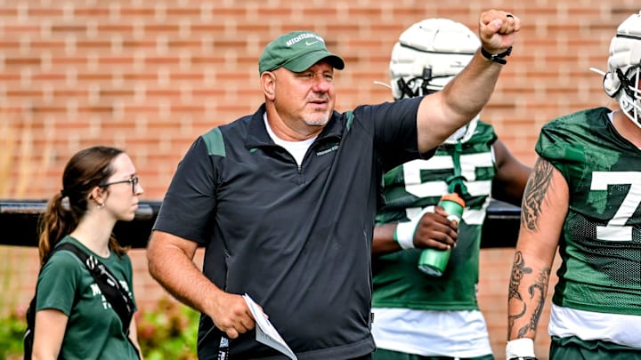 Michigan State's offensive line coach Jim Michalczik works with the team during the first day of football camp on Tuesday, July 30, 2024, in East Lansing.
