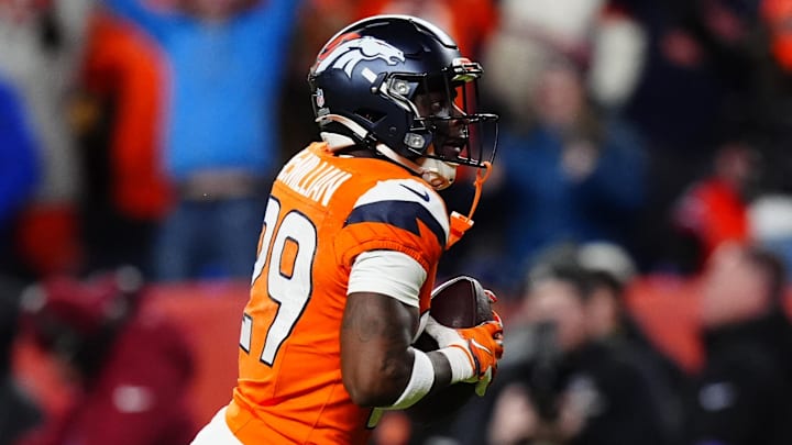 Jan 17, 2026; Denver, CO, USA; Denver Broncos cornerback Ja'quan McMillian (29) celebrates after intercepting a pass intended for Buffalo Bills wide receiver Brandin Cooks (not pictured) during overtime of an AFC Divisional Round playoff game at Empower Field at Mile High. Mandatory Credit: Ron Chenoy-Imagn Images