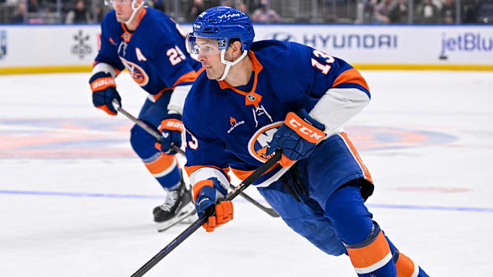 Oct 26, 2024; Elmont, New York, USA;  New York Islanders center Mathew Barzal (13) skates with the puck against the Florida Panthers during the second period at UBS Arena. Mandatory Credit: Dennis Schneidler-Imagn Images