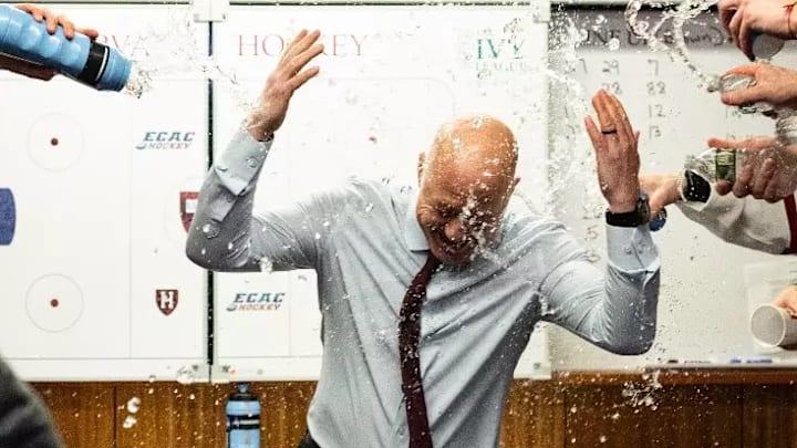 Harvard celebrates after Ted Donato recorded his 325th career victory to pass his former coach Bill Cleary, making him the winningest coach in program history, with the Crimson's 7-3 victory over Brown 7-3 on Dec. 6, 2025. Harvard celebrates after Ted Donato recorded his 325th career victory to pass his former coach Bill Cleary, making him the winningest coach in program history, with the Crimson's 7-3 victory over Brown 7-3 on Dec. 6, 2025.