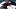 Dark blue Washington Nationals hat on top of a black mitt Dark blue Washington Nationals hat on top of a black mitt