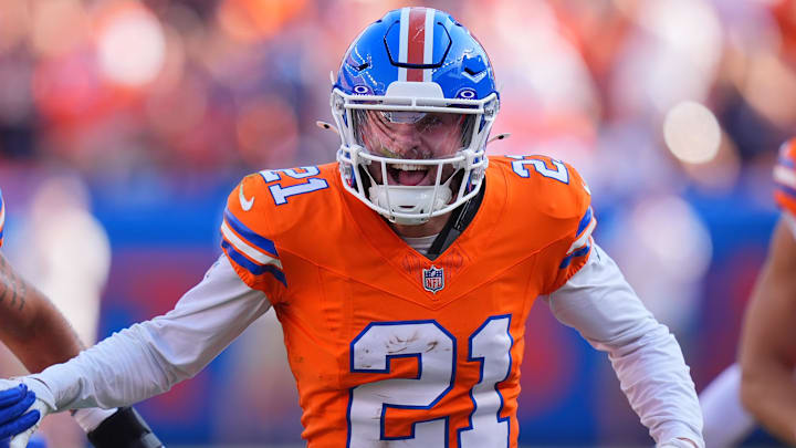 Oct 6, 2024; Denver, Colorado, USA; Denver Broncos cornerback Riley Moss (21) celebrates his interception in the second half against the Las Vegas Raiders at Empower Field at Mile High. Oct 6, 2024; Denver, Colorado, USA; Denver Broncos cornerback Riley Moss (21) celebrates his interception in the second half against the Las Vegas Raiders at Empower Field at Mile High.