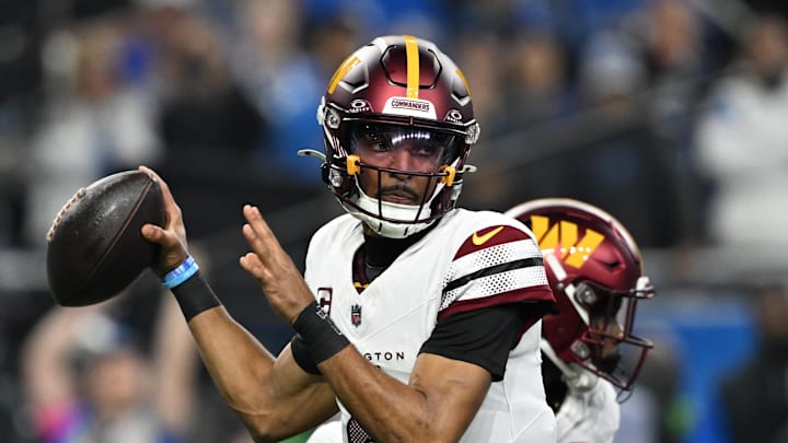  Washington Commanders quarterback Jayden Daniels (5) throws a pass during the first quarter against Detroit Lions in a 2025 NFC divisional round game at Ford Field. Mandatory Credit: Lon Horwedel-Imagn Images