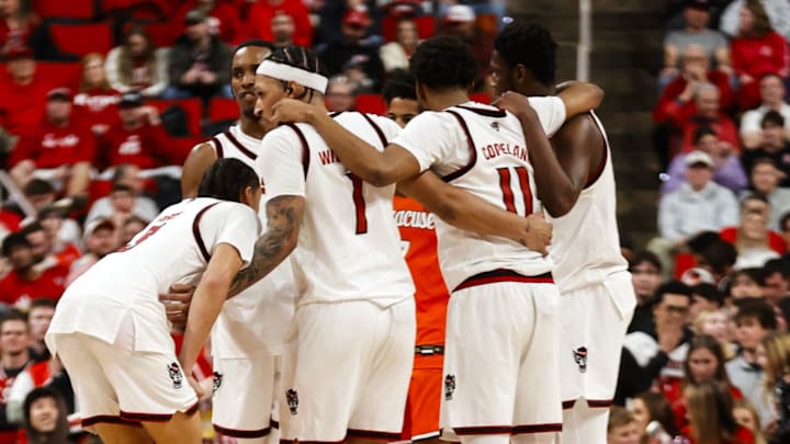 Jan 27, 2026; Raleigh, North Carolina, USA; NC State Wolfpack players huddle during the second half of the game against the Syracuse Orange at Lenovo Center. Mandatory Credit: Jaylynn Nash-Imagn Images