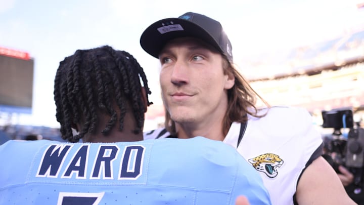 Nov 30, 2025; Nashville, Tennessee, USA; Tennessee Titans quarterback Cam Ward (1)  hugs Jacksonville Jaguars quarterback Trevor Lawrence (16) following a game at Nissan Stadium. Mandatory Credit: Steve Roberts-Imagn Images