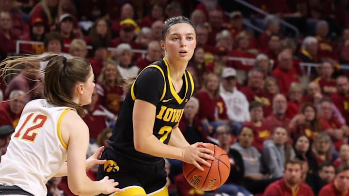 Dec 10, 2025; Ames, Iowa, USA; Iowa Hawkeyes Taylor McCabe (2) is guarded by Iowa State Cyclones Kenzie Hare (12) during the second half at James H. Hilton Coliseum. Mandatory Credit: Reese Strickland-Imagn Images