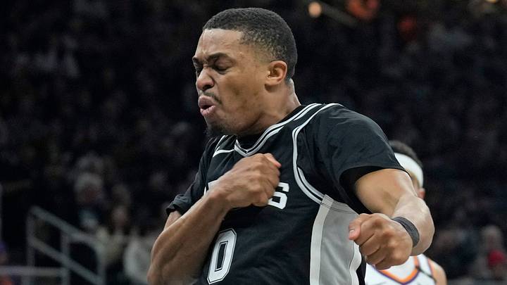 Feb 20, 2025; Austin, Texas, USA; San Antonio Spurs forward Keldon Johnson (0) reacts after drawing a foul while scoring during the second half against the Phoenix Suns at Moody Center. Mandatory Credit: Scott Wachter-Imagn Images