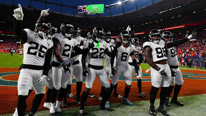Dec 21, 2025; Denver, Colorado, USA; The Jacksonville Jaguars defense reacts during the second half at Empower Field at Mile High. Mandatory Credit: Ron Chenoy-Imagn Images