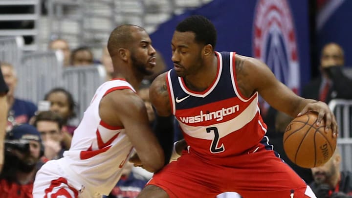 Dec 29, 2017; Washington, DC, USA; Washington Wizards guard John Wall (2) dribbles the ball as Houston Rockets guard Chris Paul (3) defends in the first quarter at Capital One Arena. Mandatory Credit: Geoff Burke-Imagn Images