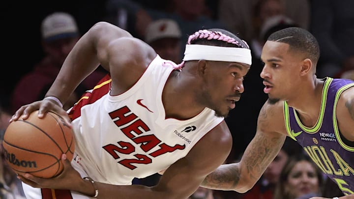 Jan 1, 2025; Miami, Florida, USA;  New Orleans Pelicans guard Dejounte Murray (5) defends Miami Heat forward Jimmy Butler (22) during the first half at Kaseya Center. Mandatory Credit: Rhona Wise-Imagn Images