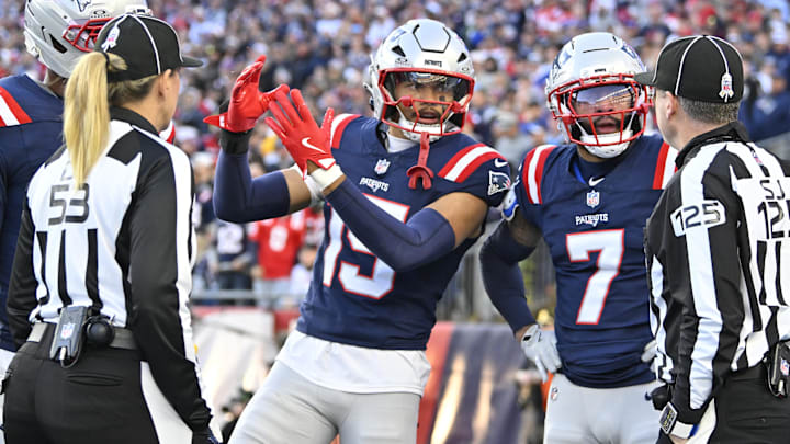 Nov 2, 2025; Foxborough, Massachusetts, USA; New England Patriots linebacker Marte Mapu (15) and cornerback Carlton Davis III (7) question down judge Sarah Thomas (53) and side judge Chad Hill (125) on a Atlanta Falcons touchdown catch during the fourth quarter at Gillette Stadium. Mandatory Credit: Eric Canha-Imagn Images