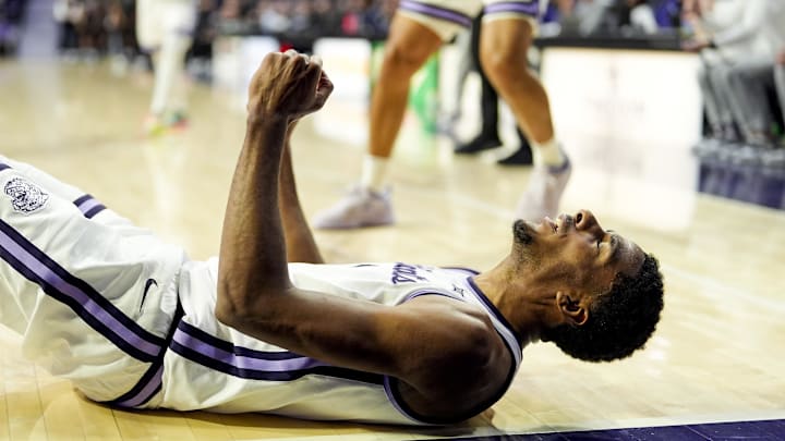 Dec 30, 2024; Manhattan, Kansas, USA; Kansas State Wildcats guard David N'Guessan (1) celebrates after scoring during the second half against the Cincinnati Bearcats at Bramlage Coliseum. Mandatory Credit: Jay Biggerstaff-Imagn Images