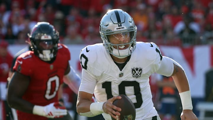 Dec 8, 2024; Tampa, Florida, USA; Las Vegas Raiders quarterback Desmond Ridder (10) runs with the ball against the Tampa Bay Buccaneers during the second half at Raymond James Stadium. Mandatory Credit: Kim Klement Neitzel-Imagn Images Dec 8, 2024; Tampa, Florida, USA; Las Vegas Raiders quarterback Desmond Ridder (10) runs with the ball against the Tampa Bay Buccaneers during the second half at Raymond James Stadium. Mandatory Credit: Kim Klement Neitzel-Imagn Images