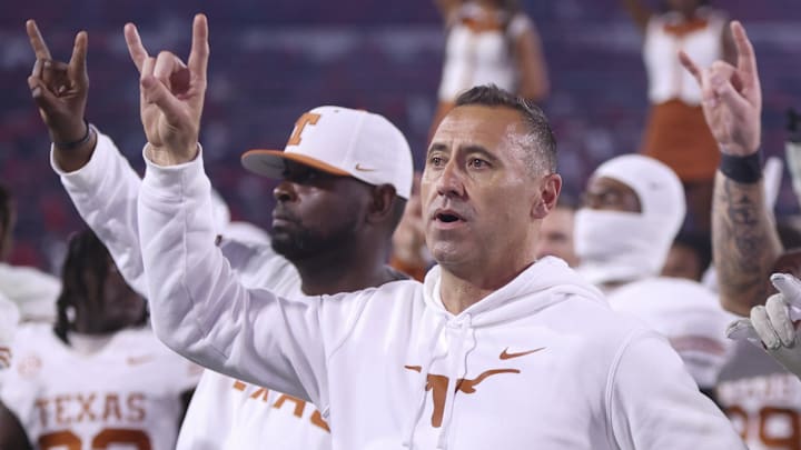 Texas Longhorns coach Steve Sarkisian and team gesture after the game against the Georgia Bulldogs at Sanford Stadium in Athens, Ga.