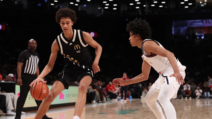 Apr 1, 2025; Brooklyn, NY, USA; McDonald's All American East forward Nate Ament (10) dribbles the ball against McDonald's All American West guard Mikel Brown Jr. (11) during the second half of the game at Barclays Center. Mandatory Credit: Pamela Smith-Imagn Images