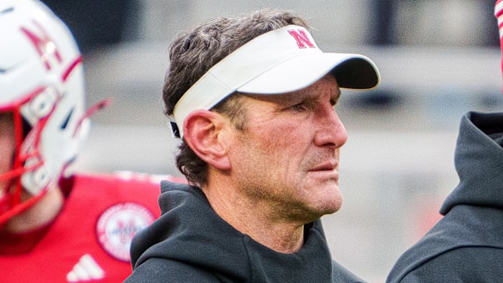 Nov 28, 2025; Lincoln, Nebraska, USA; Nebraska Cornhuskers assistant coach Mike Ekeler (left) watches warmups before the game against the Iowa Hawkeyes at Memorial Stadium. 
