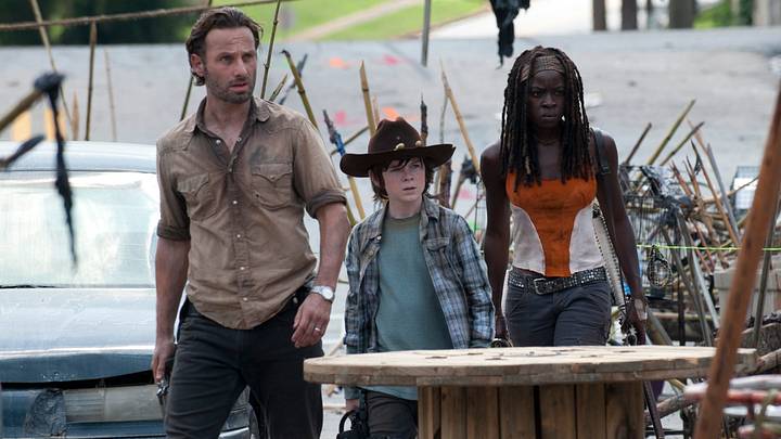 Rick Grimes (Andrew Lincoln), Carl Grimes (Chandler Riggs), and Michonne (Danai Gurira) - The Walking Dead season 3 Rick Grimes (Andrew Lincoln), Carl Grimes (Chandler Riggs), and Michonne (Danai Gurira) - The Walking Dead season 3