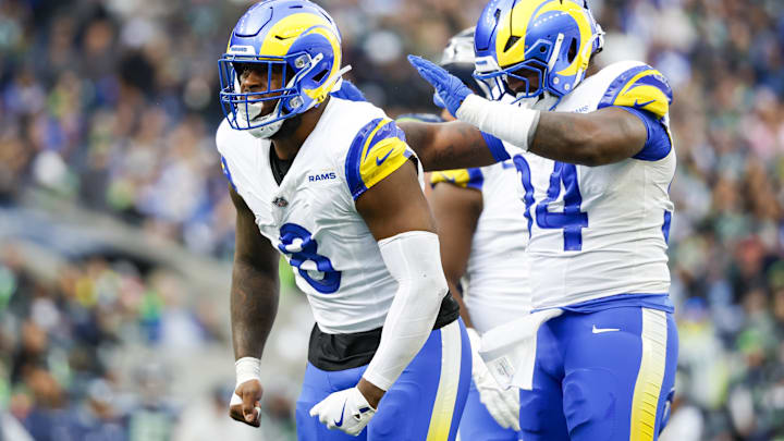 Nov 3, 2024; Seattle, Washington, USA; Los Angeles Rams linebacker Jared Verse (8) celebrates with cornerback Cobie Durant (14) after a sack against the Seattle Seahawks during the second quarter at Lumen Field. Mandatory Credit: Joe Nicholson-Imagn Images