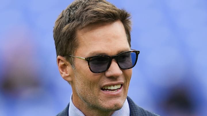 Oct 12, 2025; Baltimore, Maryland, USA; Fox Sports announcer Tom Brady looks on before the game between the Baltimore Ravens and the Los Angeles Rams at M&T Bank Stadium. Mandatory Credit: Mitch Stringer-Imagn Images
