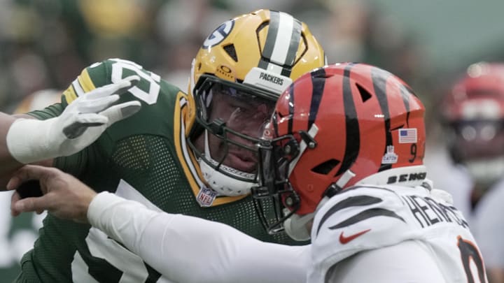 Green Bay Packers right tackle Zach Tom (50) blocks Cincinnati Bengals star Trey Hendrickson last week. Green Bay Packers right tackle Zach Tom (50) blocks Cincinnati Bengals star Trey Hendrickson last week.