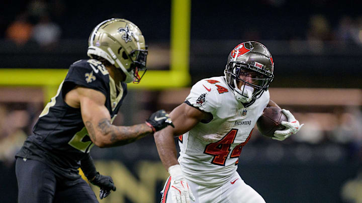 Oct 13, 2024; New Orleans, Louisiana, USA; Tampa Bay Buccaneers running back Sean Tucker (44) runs against New Orleans Saints cornerback Marshon Lattimore (23) during the fourth quarter at Caesars Superdome. Mandatory Credit: Matthew Hinton-Imagn Images
