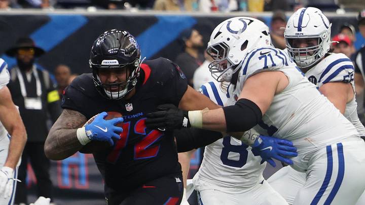 Jan 4, 2026; Houston, Texas, USA; Houston Texans defensive tackle Tommy Togiai (72) carries the ball for a touchdown after recovering a fumble against the Indianapolis Colts during the second half at NRG Stadium. Mandatory Credit: Thomas Shea-Imagn Images Jan 4, 2026; Houston, Texas, USA; Houston Texans defensive tackle Tommy Togiai (72) carries the ball for a touchdown after recovering a fumble against the Indianapolis Colts during the second half at NRG Stadium. Mandatory Credit: Thomas Shea-Imagn Images