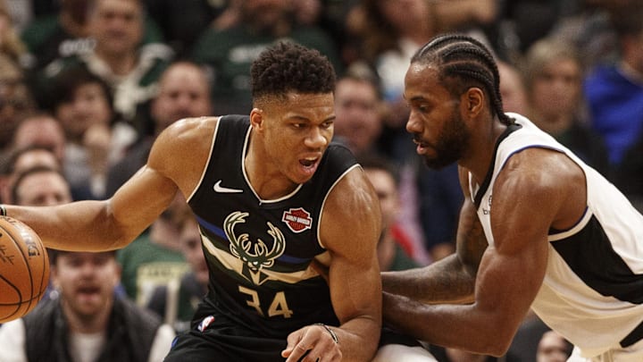 Dec 6, 2019; Milwaukee, WI, USA; Milwaukee Bucks forward Giannis Antetokounmpo (34) works for a shot against Los Angeles Clippers forward Kawhi Leonard (2) during the third quarter at Fiserv Forum. Mandatory Credit: Jeff Hanisch-Imagn Images