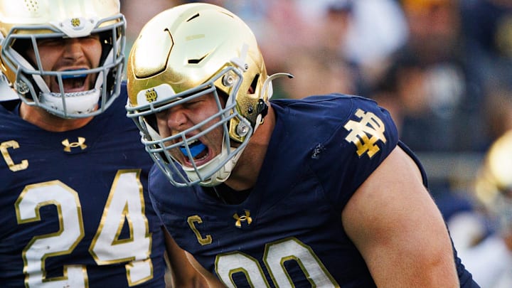 Notre Dame defensive lineman Rylie Mills (99) and linebacker Jack Kiser (24) celebrate a sack by Mills during a NCAA college football game between Notre Dame and Stanford at Notre Dame Stadium on Saturday, Oct. 12, 2024, in South Bend.
