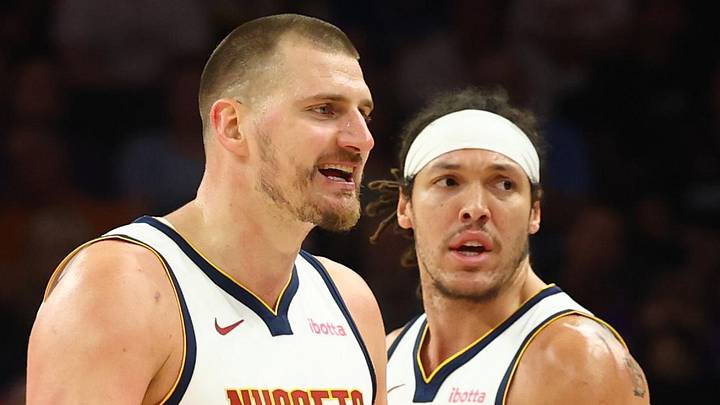 Mar 24, 2026; Phoenix, Arizona, USA; Denver Nuggets center Nikola Jokic (15) and forward Aaron Gordon (32) against the Phoenix Suns at Mortgage Matchup Center. Mandatory Credit: Mark J. Rebilas-Imagn Images