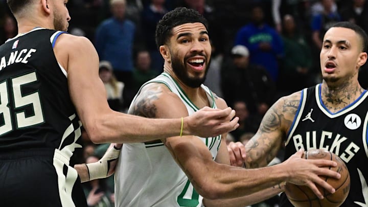 Apr 3, 2026; Milwaukee, Wisconsin, USA;  Boston Celtics forward Jayson Tatum (0) drives for the basket between Milwaukee Bucks forward Pete Nance (35) and forward Kyle Kuzma (18) in the first quarter at Fiserv Forum. Mandatory Credit: Benny Sieu-Imagn Images