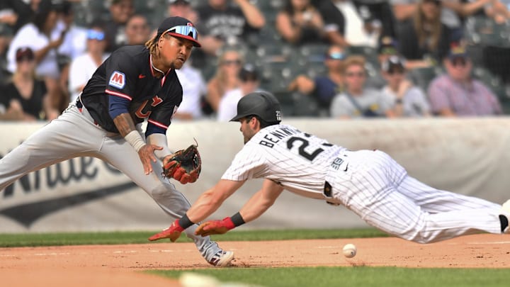 Jul 12, 2025; Chicago, Illinois, USA; Chicago White Sox left fielder Andrew Benintendi (23) steals third base as Cleveland Guardians third baseman Jose Ramirez (11) fields a relay throw during the fourth inning at Rate Field. Mandatory Credit: Patrick Gorski-Imagn Images