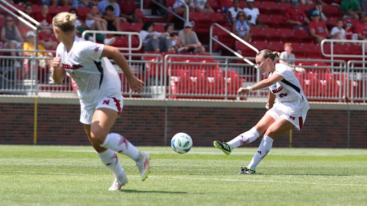 Nebraska midfielder Ella Rudney takes a shot while forward Ava Makovicka looks for space. Rudney's strike found the back of the net to tie the game.