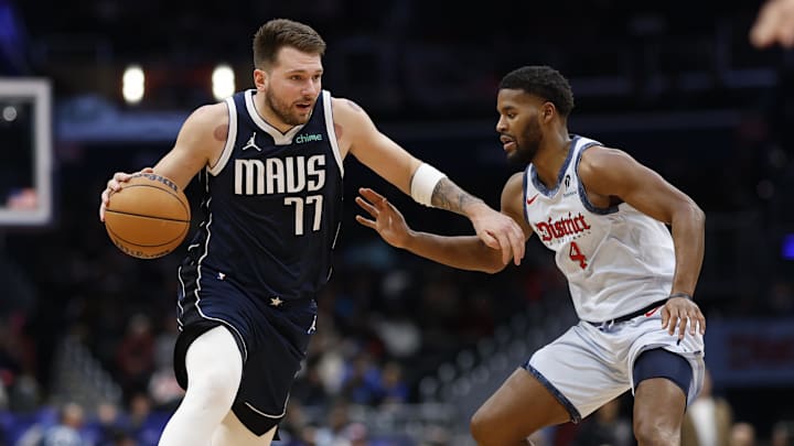 Dec 5, 2024; Washington, District of Columbia, USA; Dallas Mavericks guard Luka Doncic (77) drives to the basket as Washington Wizards guard Jared Butler (4) defends in the second quarter at Capital One Arena. Mandatory Credit: Geoff Burke-Imagn Images Dec 5, 2024; Washington, District of Columbia, USA; Dallas Mavericks guard Luka Doncic (77) drives to the basket as Washington Wizards guard Jared Butler (4) defends in the second quarter at Capital One Arena. Mandatory Credit: Geoff Burke-Imagn Images