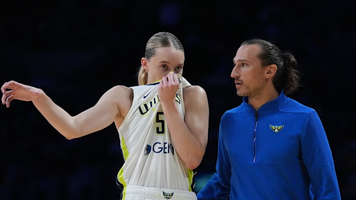 Dallas Wings coach Chris Koclanes talks with guard Paige Bueckers (5) against the LA Sparks in the first half at Crypto.com Arena. Mandatory Credit: Kirby Lee-Imagn Images