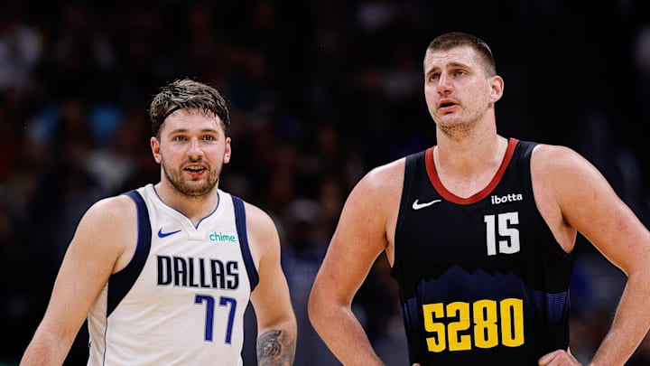 Dec 18, 2023; Denver, Colorado, USA; Dallas Mavericks guard Luka Doncic (77) and Denver Nuggets center Nikola Jokic (15) in the second quarter at Ball Arena. Mandatory Credit: Isaiah J. Downing-Imagn Images
