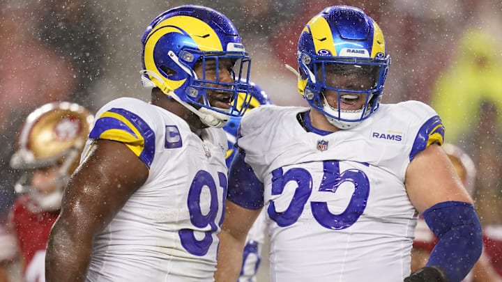 Dec 12, 2024; Santa Clara, California, USA; Los Angeles Rams defensive tackle Kobie Turner (91) is congratulated by defensive tackle Braden Fiske (55) after recording a sack against the San Francisco 49ers in the second quarter at Levi's Stadium. Mandatory Credit: Cary Edmondson-Imagn Images Dec 12, 2024; Santa Clara, California, USA; Los Angeles Rams defensive tackle Kobie Turner (91) is congratulated by defensive tackle Braden Fiske (55) after recording a sack against the San Francisco 49ers in the second quarter at Levi's Stadium. Mandatory Credit: Cary Edmondson-Imagn Images