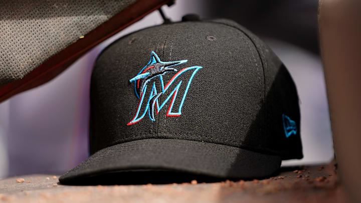 Apr 11, 2019; Cincinnati, OH, USA; A view of a New Era Miami Marlins hat in the dugout during the game against the Cincinnati Reds at Great American Ball Park. Mandatory Credit: Aaron Doster-Imagn Images