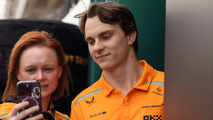 Oscar Piastri takes a photo with a fan in the Paddock at the Formula 1 Pirelli United States Grand Prix at Circuit of the Americas on Saturday, Oct. 19, 2024.