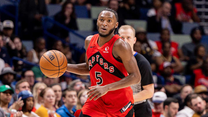 Mar 11, 2026; New Orleans, Louisiana, USA;  Toronto Raptors guard Immanuel Quickley (5) brings the ball up court against New Orleans Pelicans guard Dejounte Murray (5) during the second half at Smoothie King Center. Mandatory Credit: Stephen Lew-Imagn Images