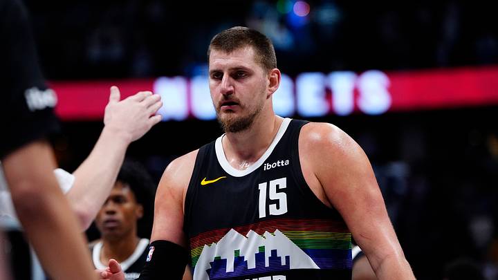 Dec 25, 2025; Denver, Colorado, USA; Denver Nuggets center Nikola Jokic (15) comes to the bench in overtime against the Minnesota Timberwolves at Ball Arena. Mandatory Credit: Ron Chenoy-Imagn Images