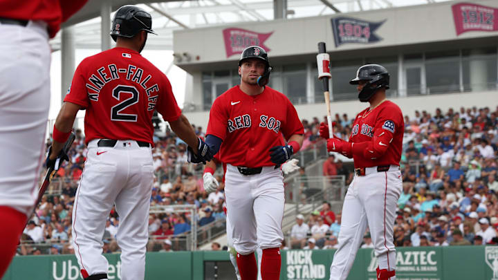Feb 22, 2026; Fort Myers, Florida, USA;  Boston Red Sox infielder Caleb Durbin (17) is congratulated by infielder Isiah Kiner-Falefa (2) after he scored during the first inning against the Toronto Blue Jays at JetBlue Park at Fenway South. Mandatory Credit: Kim Klement Neitzel-Imagn Images