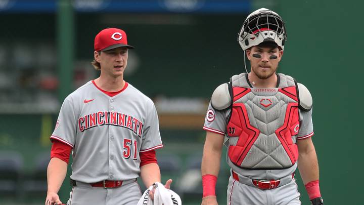 Cincinnati Reds starting pitcher Brady Singer (51) and catcher Tyler Stephenson (37)