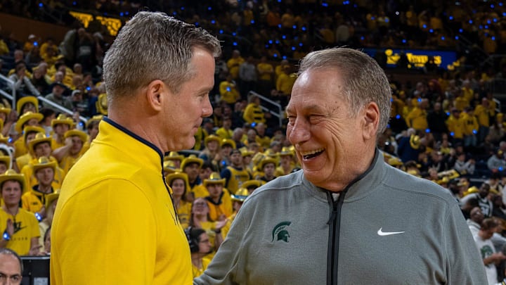 Michigan State’s Tom Izzo smiles as he greets Michigan’s Dusty May before their rivalry matchup game at Crisler Center in Ann Arbor, on Friday, Feb. 21, 2025.