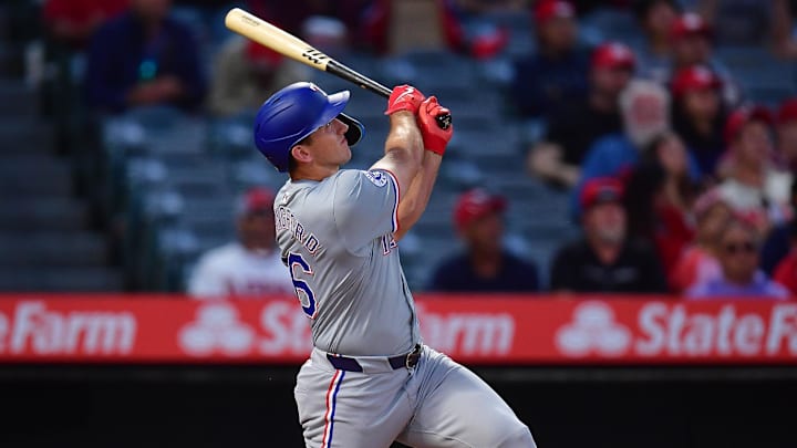 Sep 27, 2024; Anaheim, California, USA; Texas Rangers center fielder Wyatt Langford (36) hits a two run home run against the Los Angeles Angels during the first inning at Angel Stadium. Sep 27, 2024; Anaheim, California, USA; Texas Rangers center fielder Wyatt Langford (36) hits a two run home run against the Los Angeles Angels during the first inning at Angel Stadium.