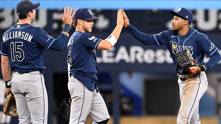 Jul 22, 2026; Toronto, Ontario, CAN; Tampa Bay Rays left fielder Chandler Simpson (14) celebrates a win over the Toronto Blue Jays with shortstop Taylor Walls (6) and second baseman Ben Williamson (15) at Rogers Centre. Mandatory Credit: Dan Hamilton-Imagn Images Jul 22, 2026; Toronto, Ontario, CAN; Tampa Bay Rays left fielder Chandler Simpson (14) celebrates a win over the Toronto Blue Jays with shortstop Taylor Walls (6) and second baseman Ben Williamson (15) at Rogers Centre. Mandatory Credit: Dan Hamilton-Imagn Images