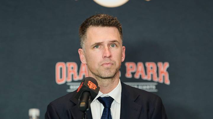 Dec 12, 2024; San Francisco, CA, USA; San Francisco Giants president of baseball operations Buster Posey listens during the introductory press conference for shortstop Willy Adames (not pictured) at Oracle Park.  Mandatory Credit: Robert Edwards-Imagn Images