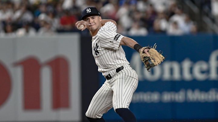 Aug 24, 2025; Bronx, New York, USA; New York Yankees shortstop Anthony Volpe (11) fields a ground ball hit by third baseman Alex Bregman (2) and throws to first for an out during the eighth inning at Yankee Stadium. Mandatory Credit: John Jones-Imagn Images