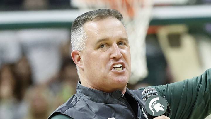 Michigan State Spartans head football coach Pat Fitzgerald points while introducing himself to the crowd at a men's basketball game against the Iowa Hawkeyes on Tuesday, Dec. 2, 2025. Fitzgerald was officially hired by MSU on Monday.